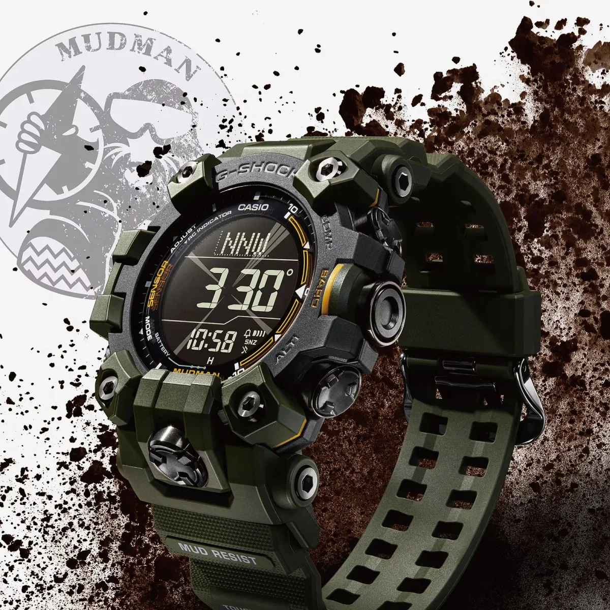 Olive green G-Shock Mudman digital watch with a black face and rugged casing, displayed against a background of scattered mud.