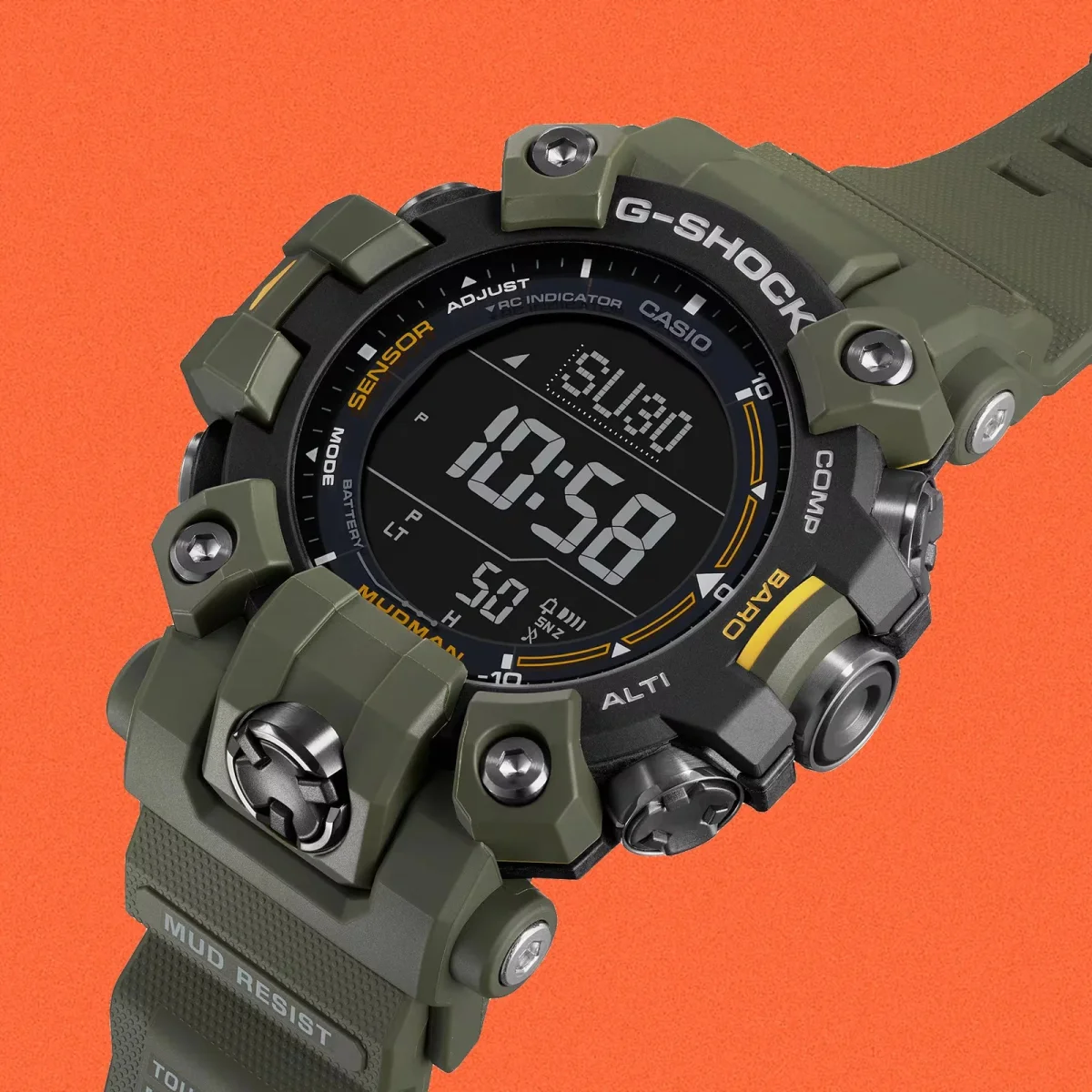 Olive green G-Shock Mudman digital watch with a black face and resin strap, set against an orange background.