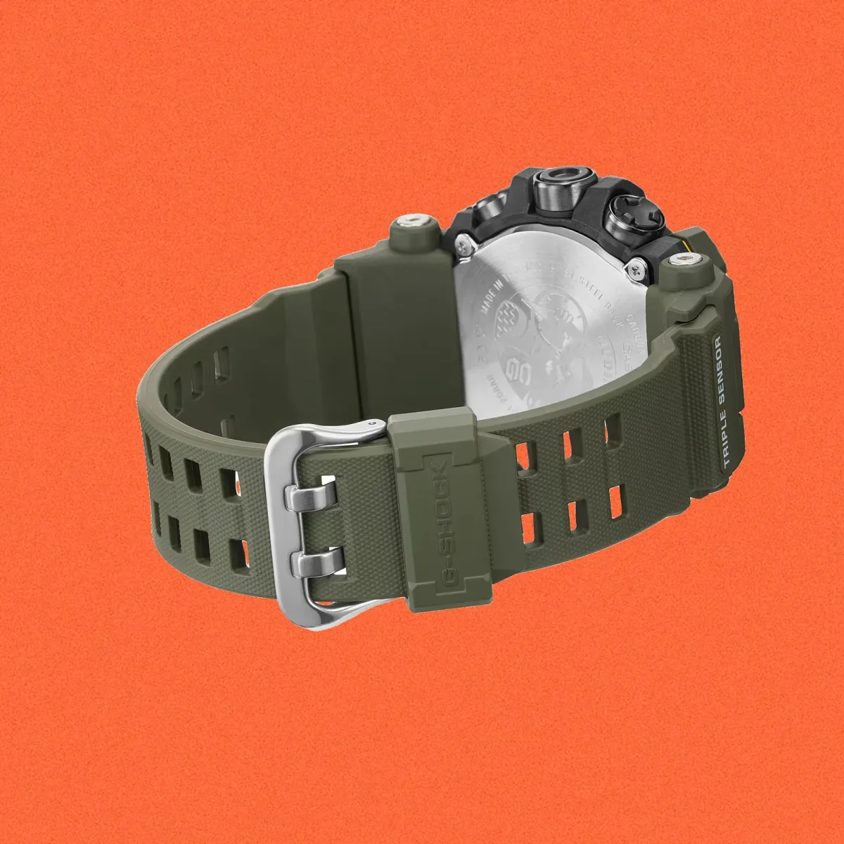 Olive green G-Shock watch featuring a textured silicone strap with a metal buckle, shown from the underside to reveal the casing.