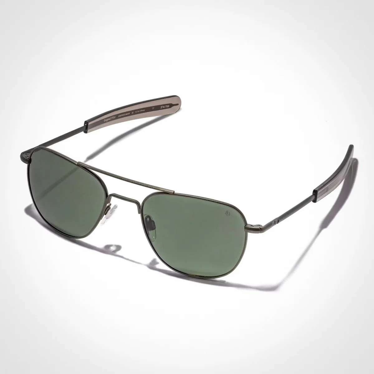 American Optical aviator sunglasses featuring dark grey metal frames and green-tinted lenses.