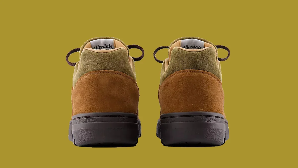 Back view of two olive green and brown low-top sneakers featuring dark laces and Allerdale branding on the heel collars.