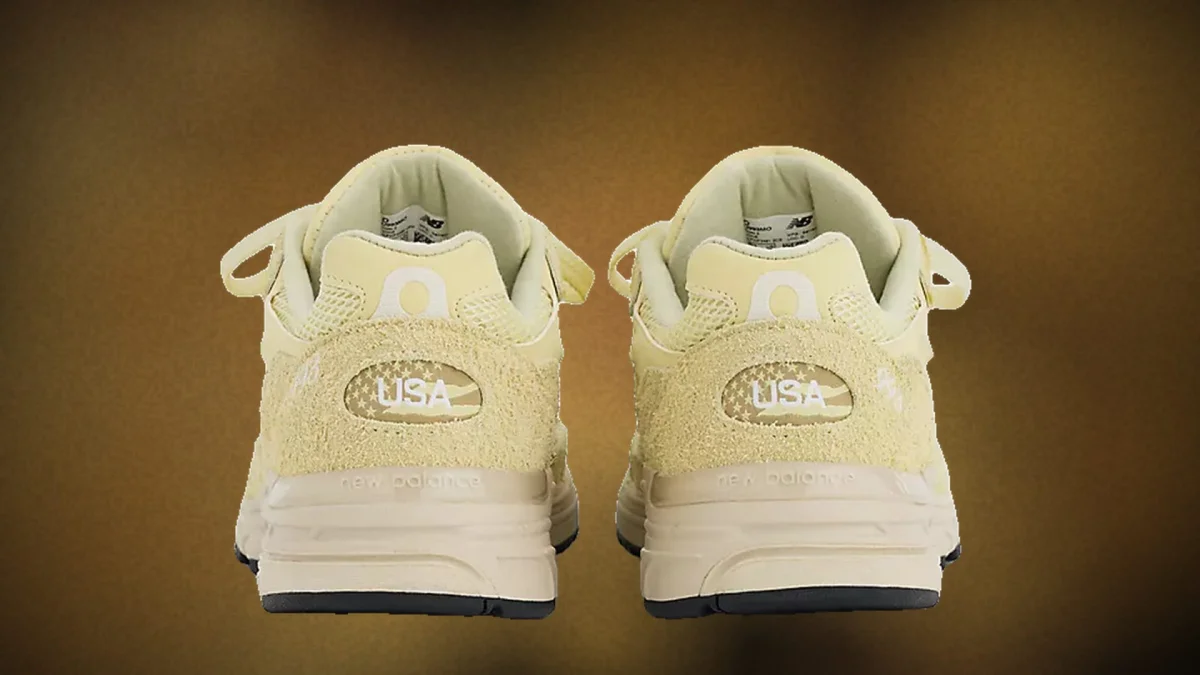 Pair of beige New Balance sneakers.