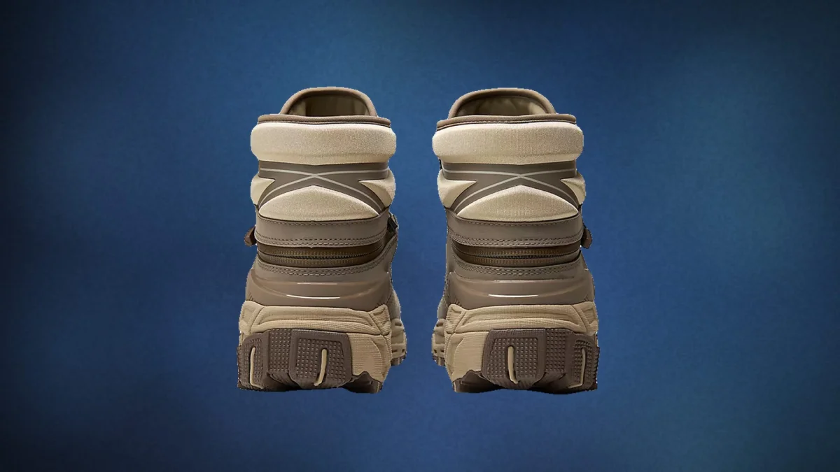 Back view of tan and brown high-top sneakers with chunky rubber soles.