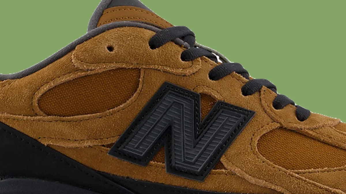 Brown suede and mesh sneaker with black laces.