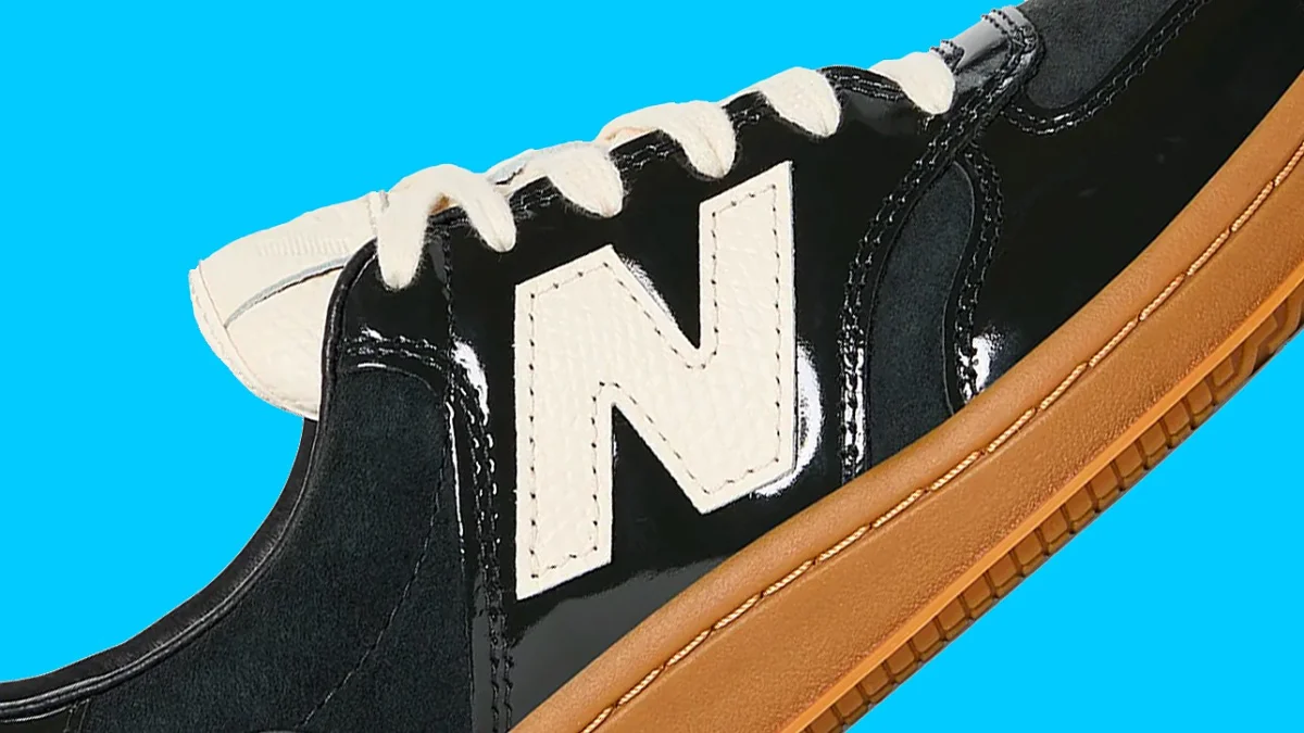 Close-up of a black New Balance sneaker with white laces.