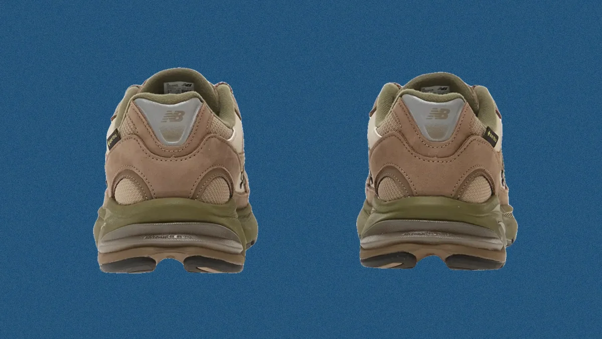 Back view of tan and olive green New Balance sneakers featuring Gore-Tex branding.