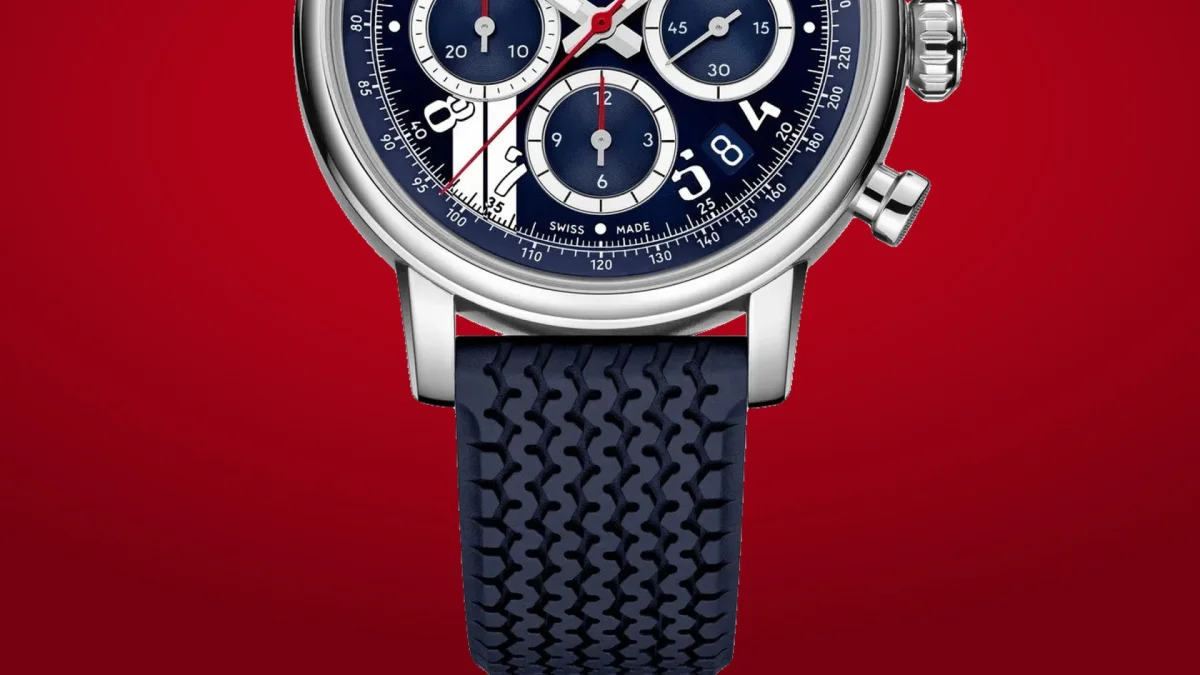 Chronograph wristwatch featuring a blue dial with three sub-dials and a date window at the 6 o’clock position, finished with a blue textured rubber strap.