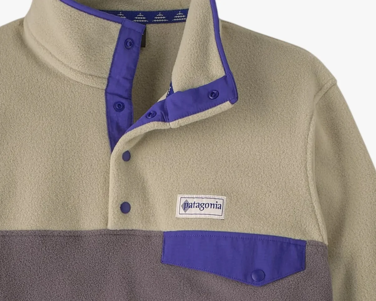 Patagonia Snap-T fleece pullover in tan and grey with purple trim and a chest pocket.