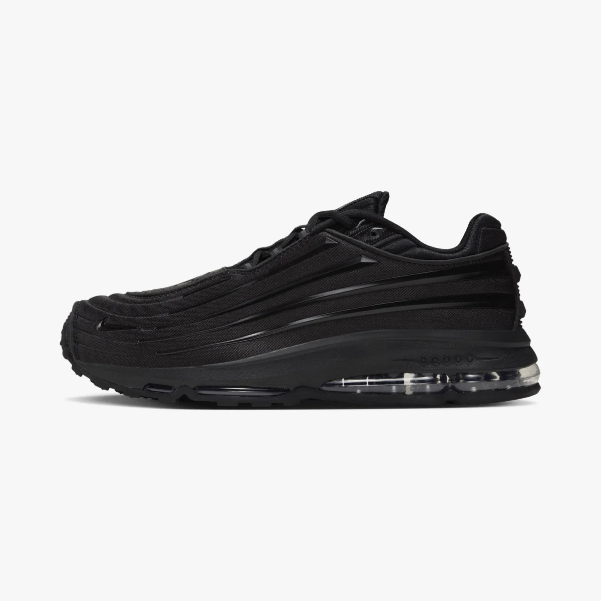 Nike Air Max sneaker in all-black featuring a layered upper and a transparent Air cushioning unit in the heel.