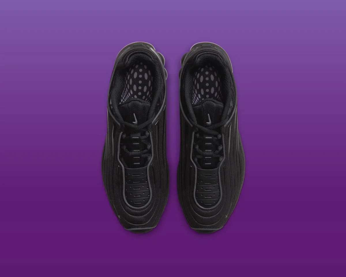 Pair of black Nike Air Max sneakers, viewed from above.