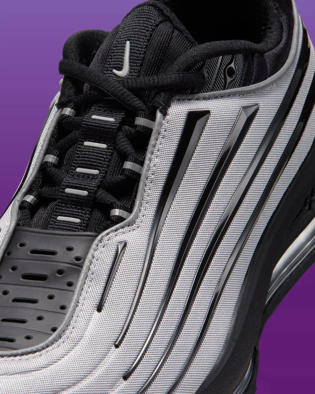 Nike Air Max sneaker in silver and black with a ribbed design and black laces.