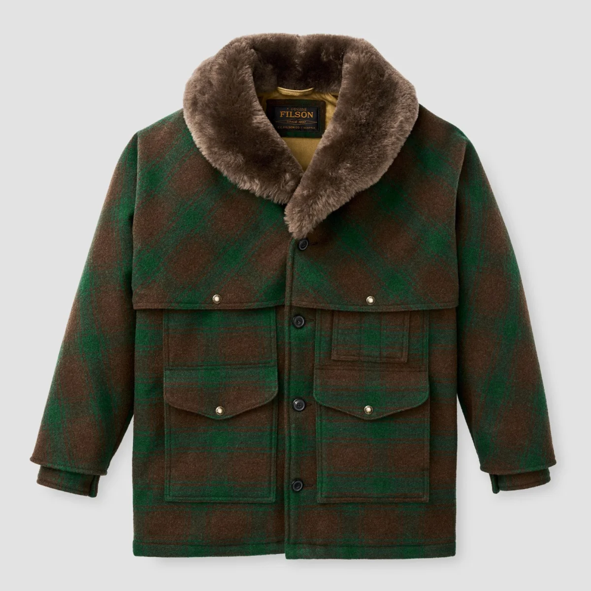 Filson green and brown plaid wool cruiser jacket featuring a faux fur shawl collar and multiple flap pockets.