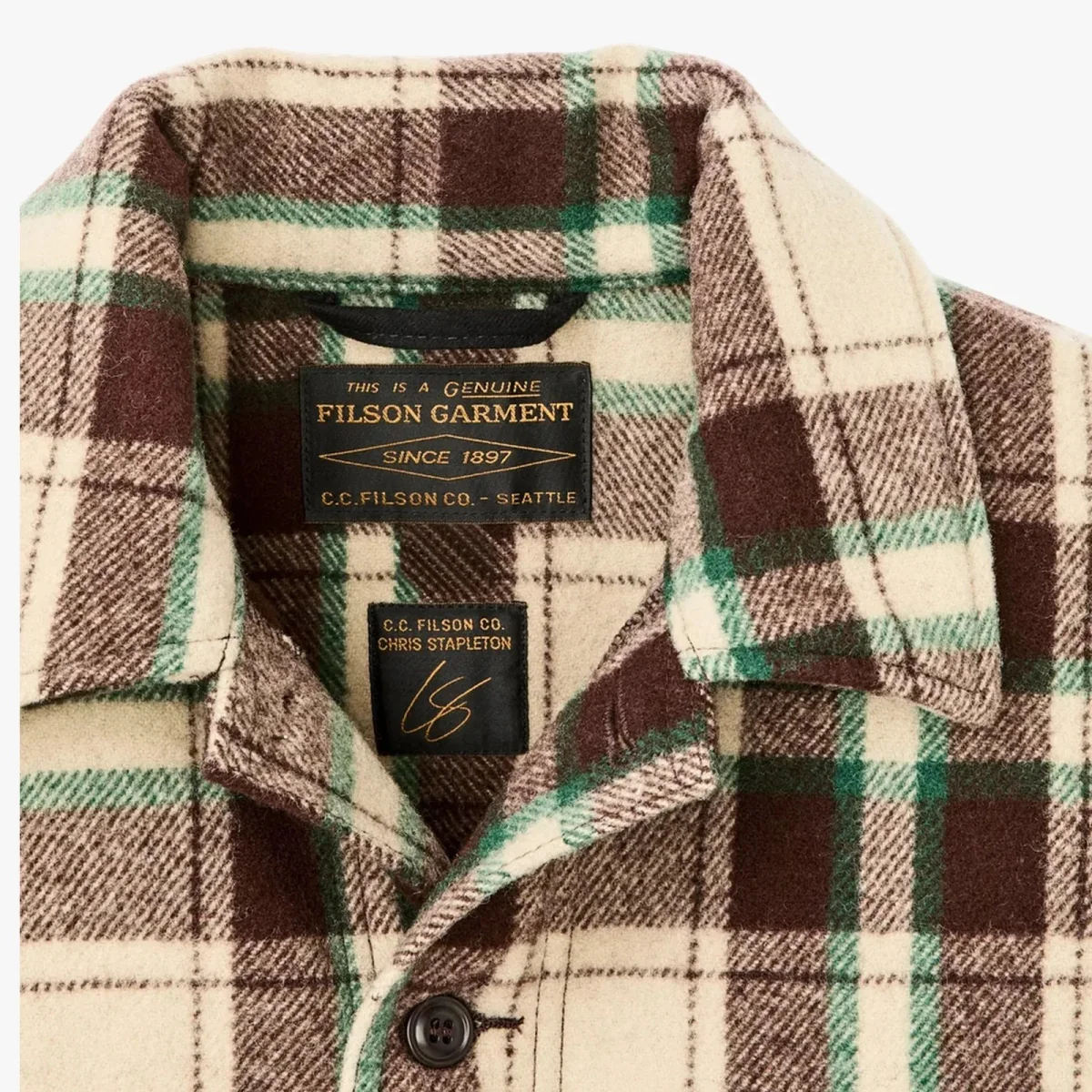 Cream, brown, and green plaid button-up shirt featuring Filson and Chris Stapleton labels stitched inside the collar.