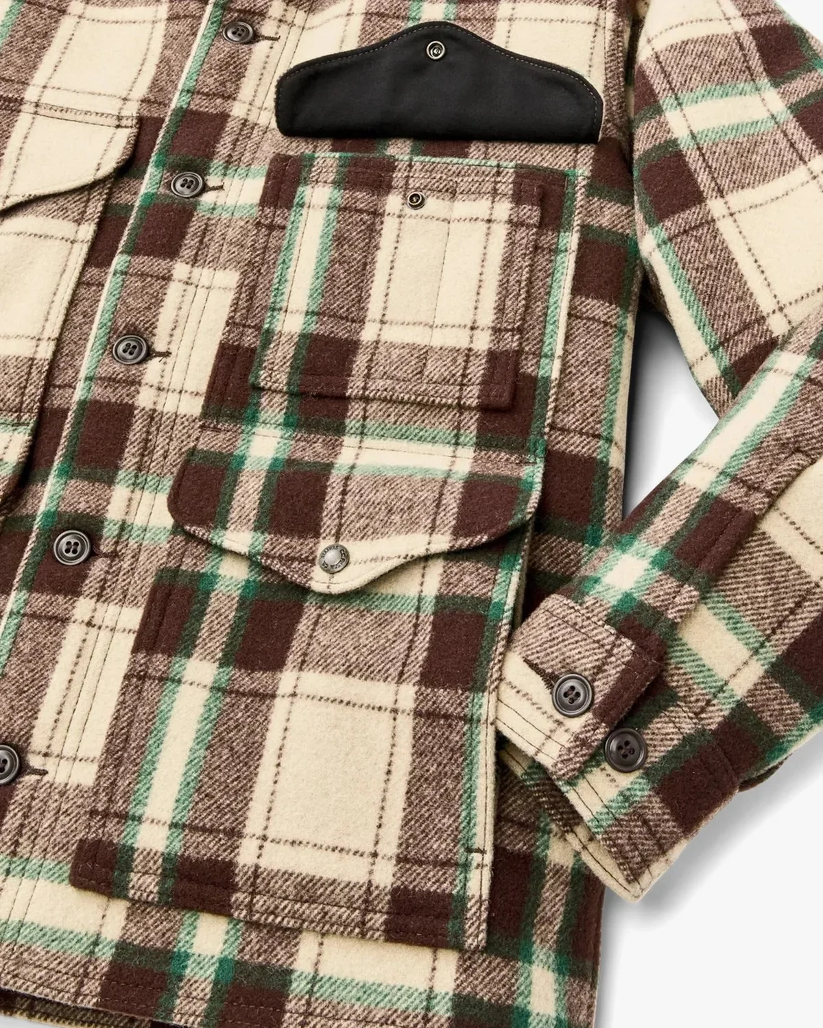 Cream, brown, and green plaid button-up jacket featuring two chest pockets and a contrasting black pocket flap.