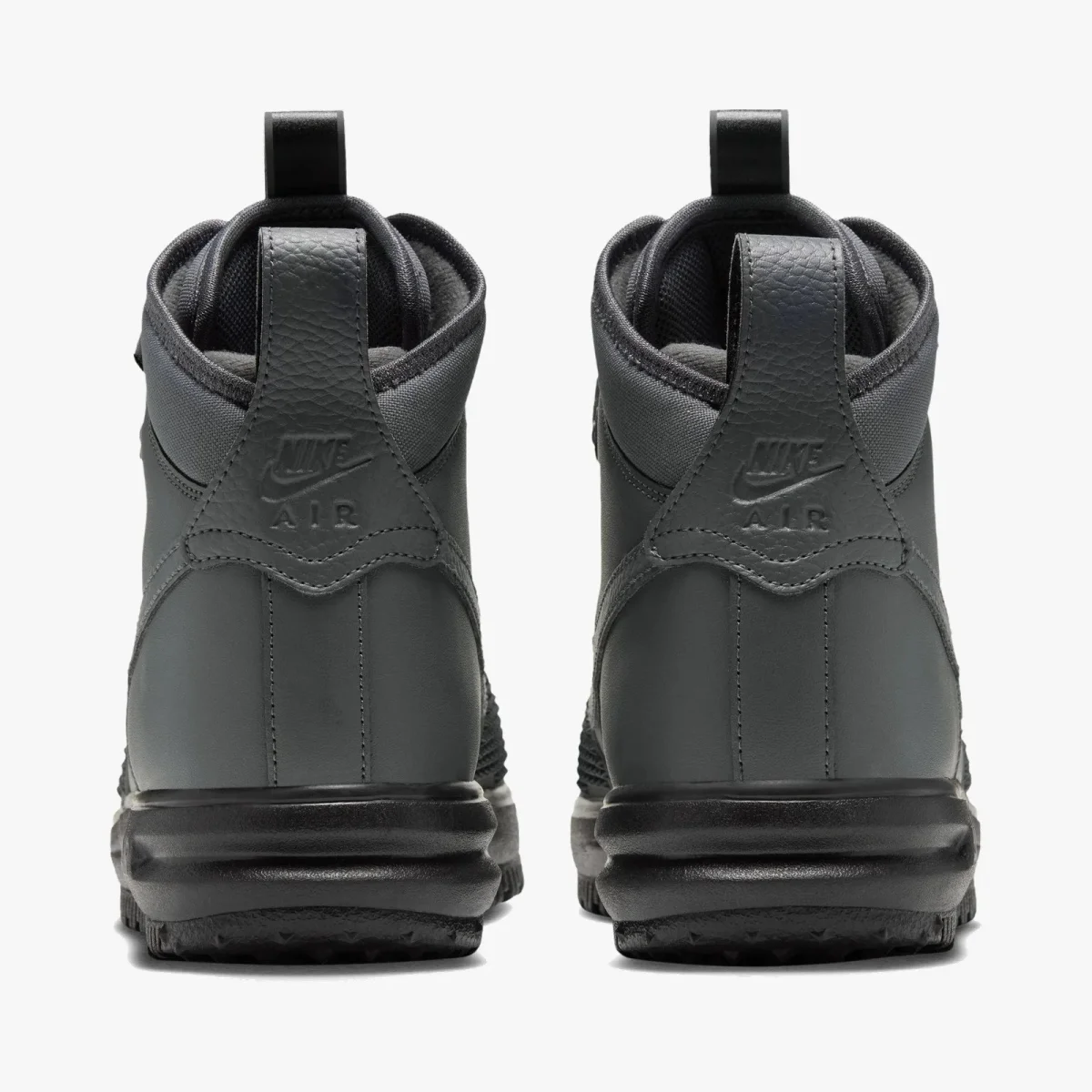 Back view of charcoal grey Nike Air high-top sneakers featuring black soles and pull tabs.
