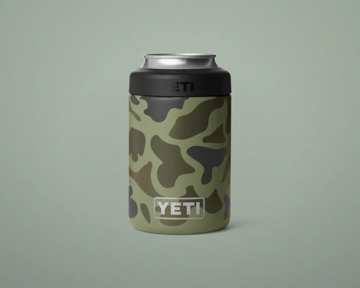 YETI camouflage beverage cooler for a standard 12-ounce can, featuring a black gasket top.