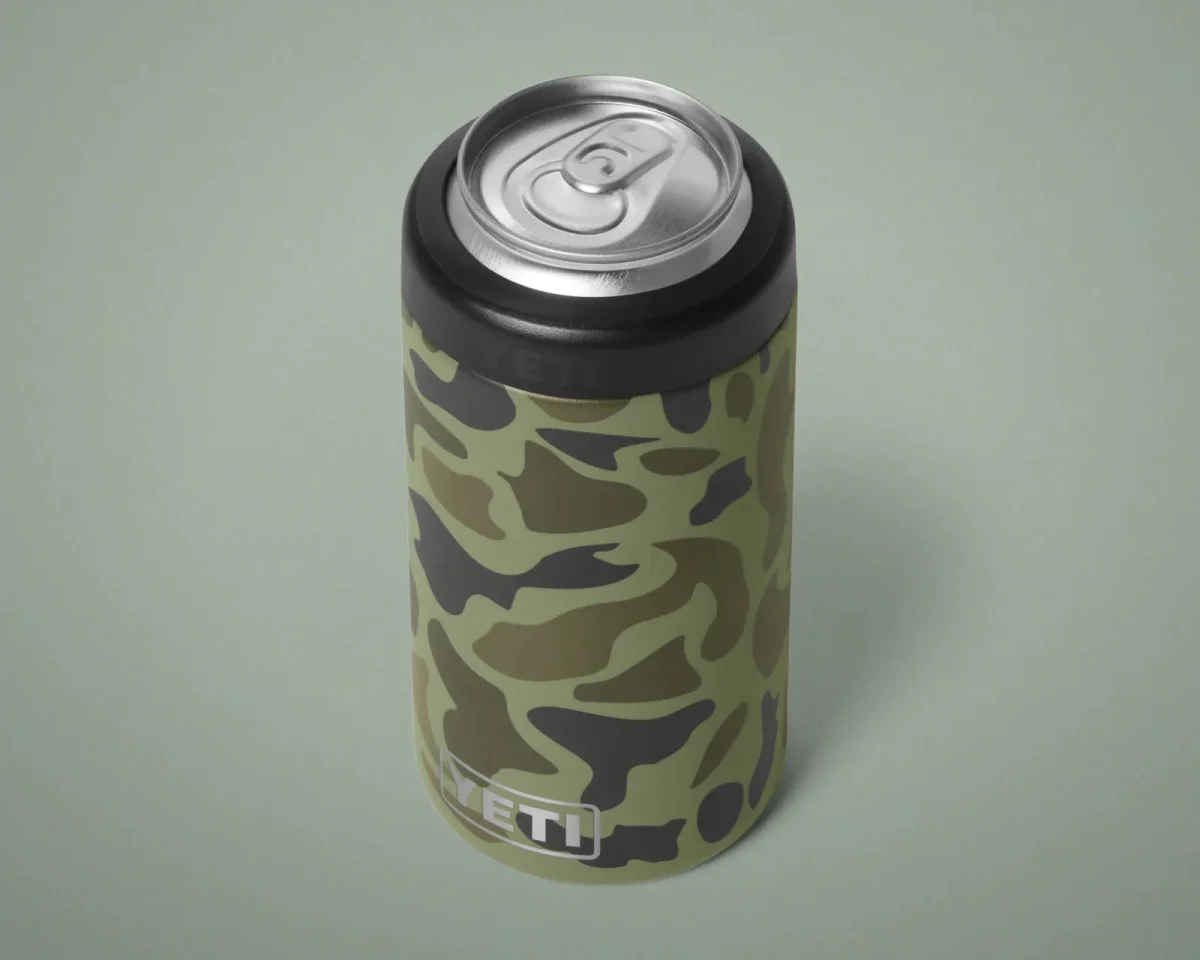 YETI slim can insulator in a green camouflage pattern with a black rim.