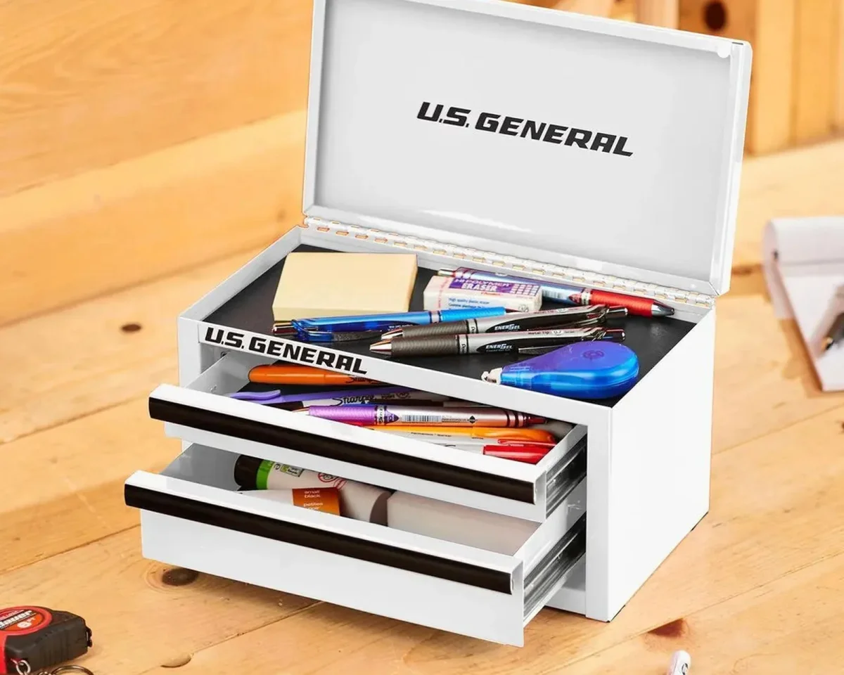 White U.S. General mini toolbox with three drawers, filled with pens and small office supplies.