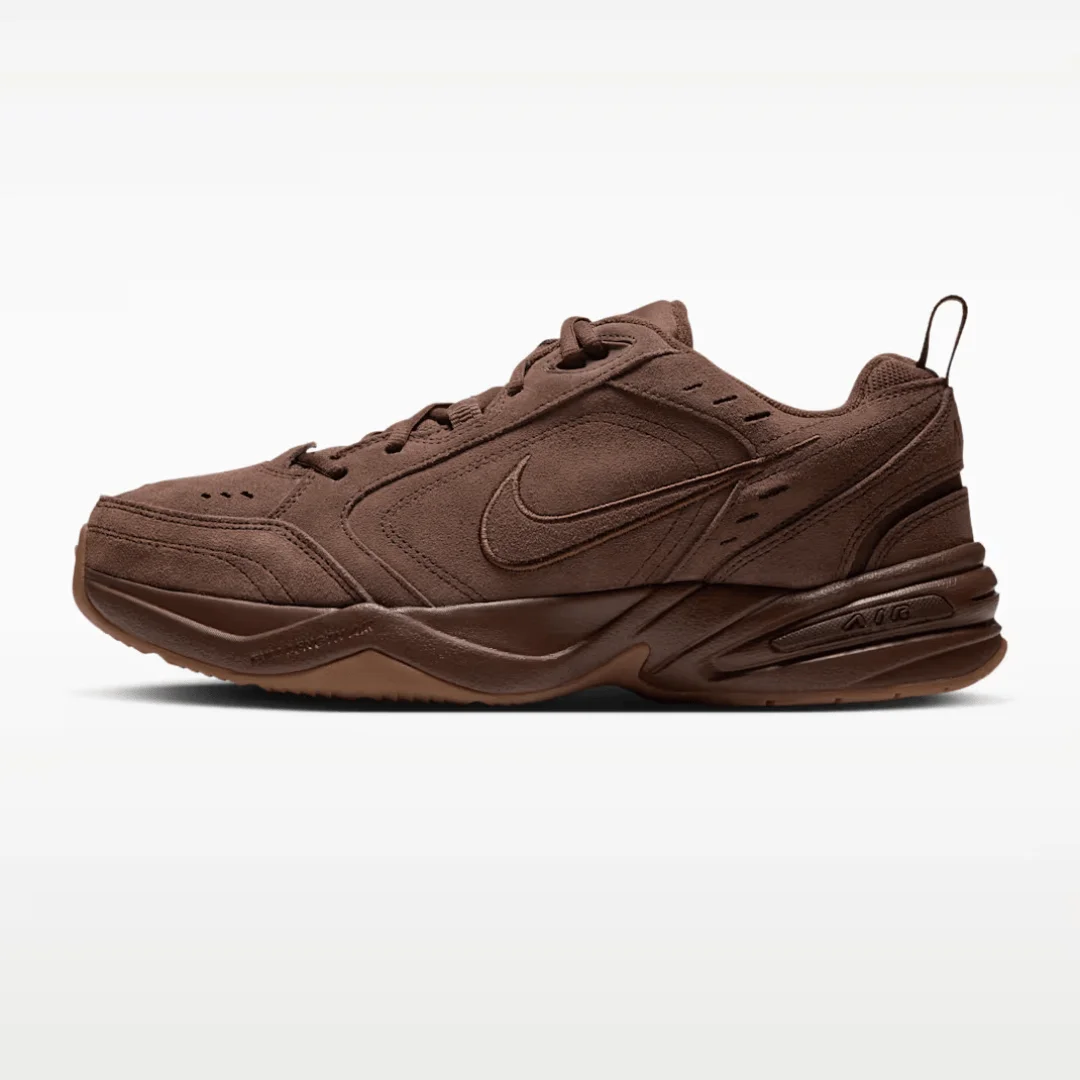 Brown Nike sneaker with a chunky sole and suede-like finish on a white background.