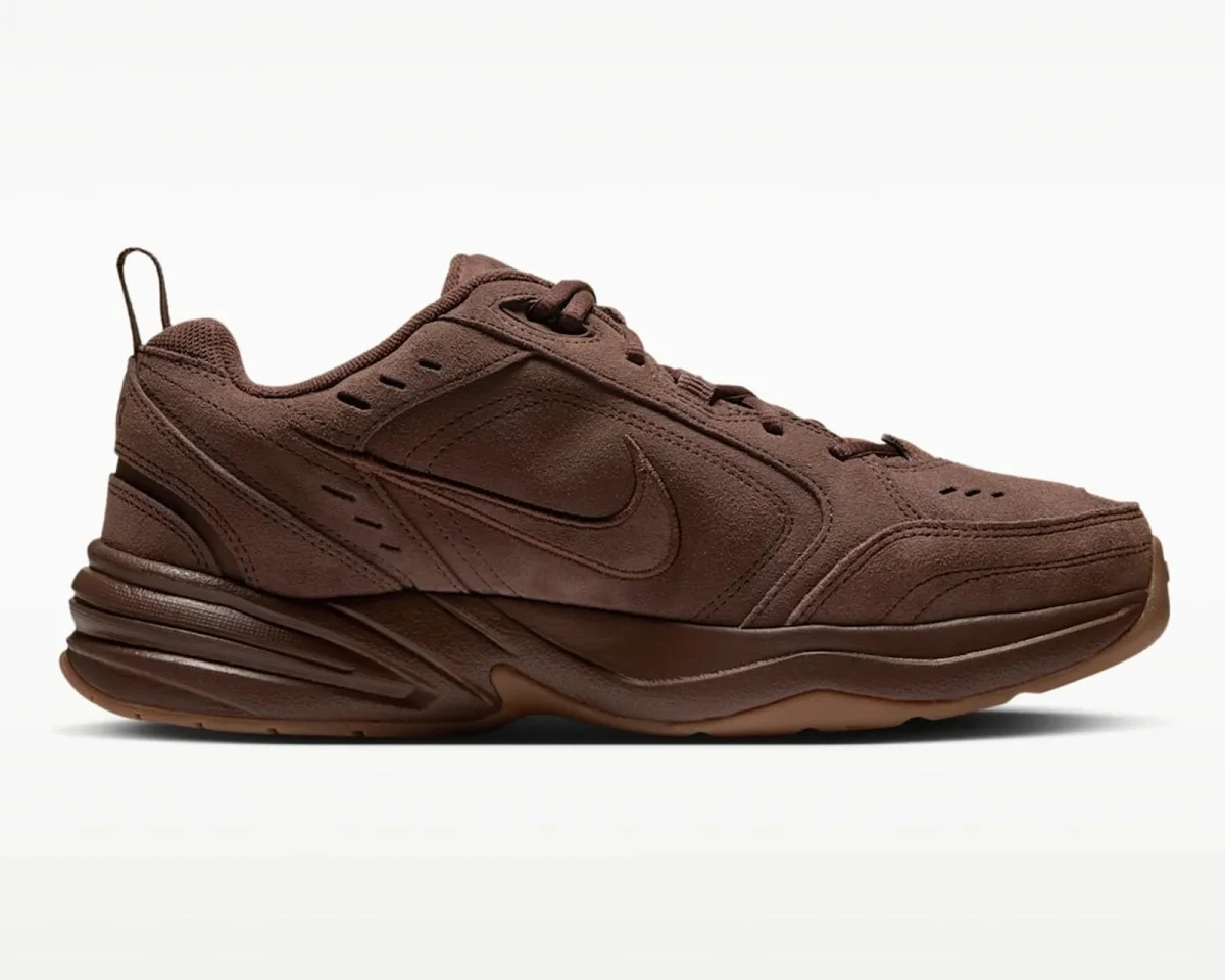 Chocolate brown Nike sneaker featuring a textured upper and a thick rubber sole.