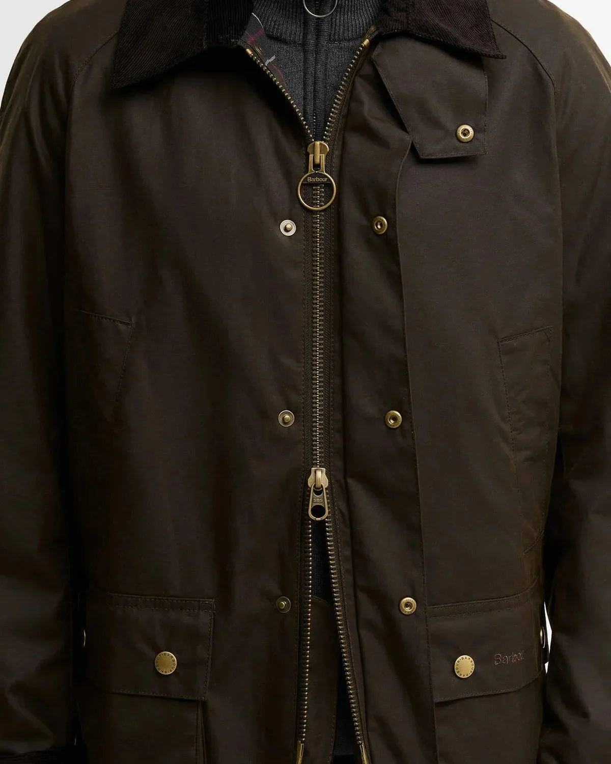 Dark brown Barbour waxed jacket featuring a corduroy collar, brass zipper, and snap-button closures.