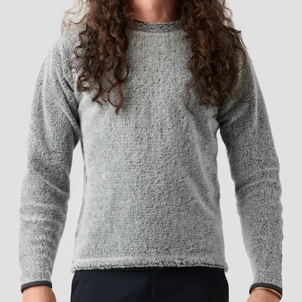 Gray, long-sleeved, textured fleece sweater with a crew neckline and black trim at the cuffs.