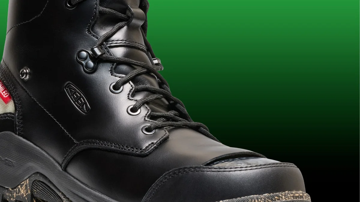 Black Keen work boot featuring a reinforced toe cap, black laces, and a red brand tab on the side.