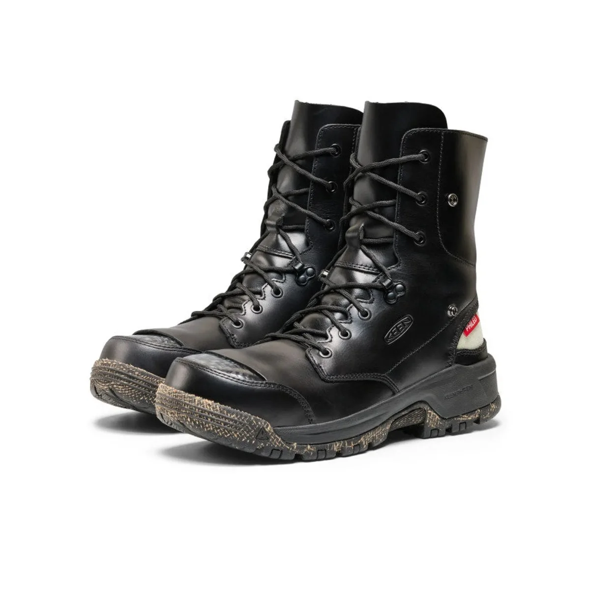 Black leather lace-up work boots with black lugged rubber soles and reinforced toe caps.