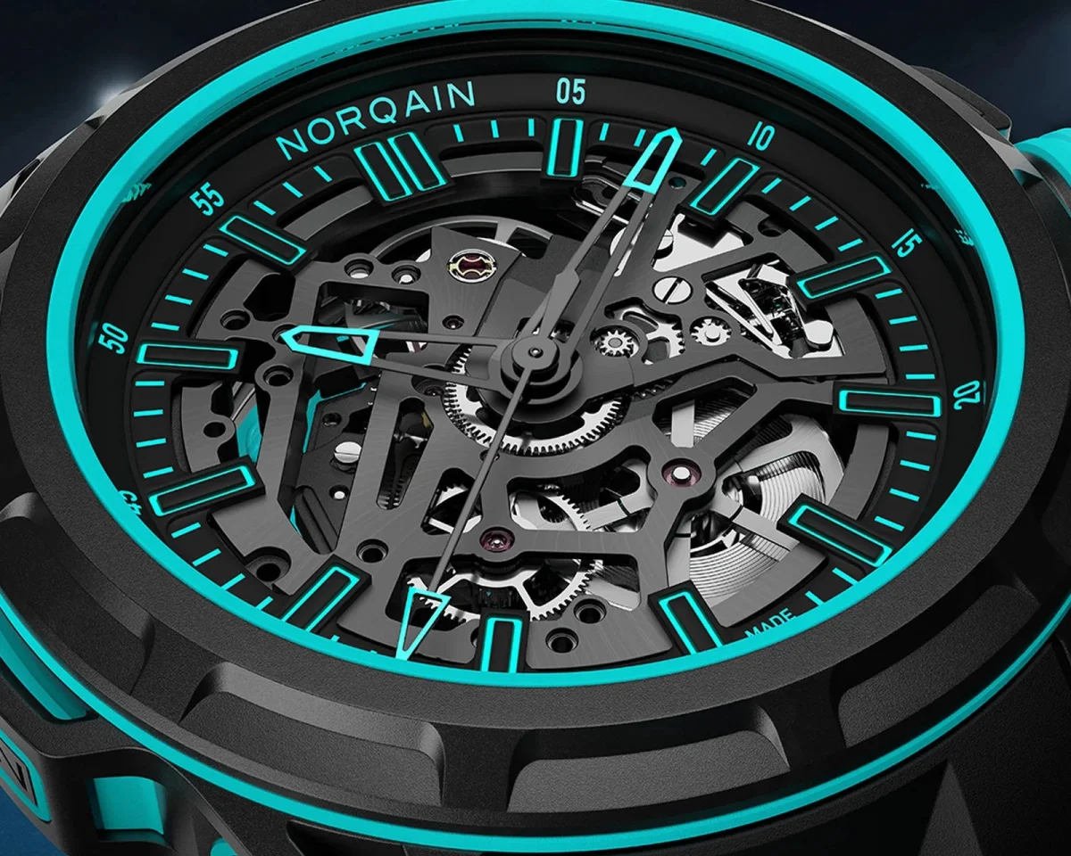 Norqain skeletonized watch face featuring a black gear mechanism with bright cyan accents on the dial markers and hands.