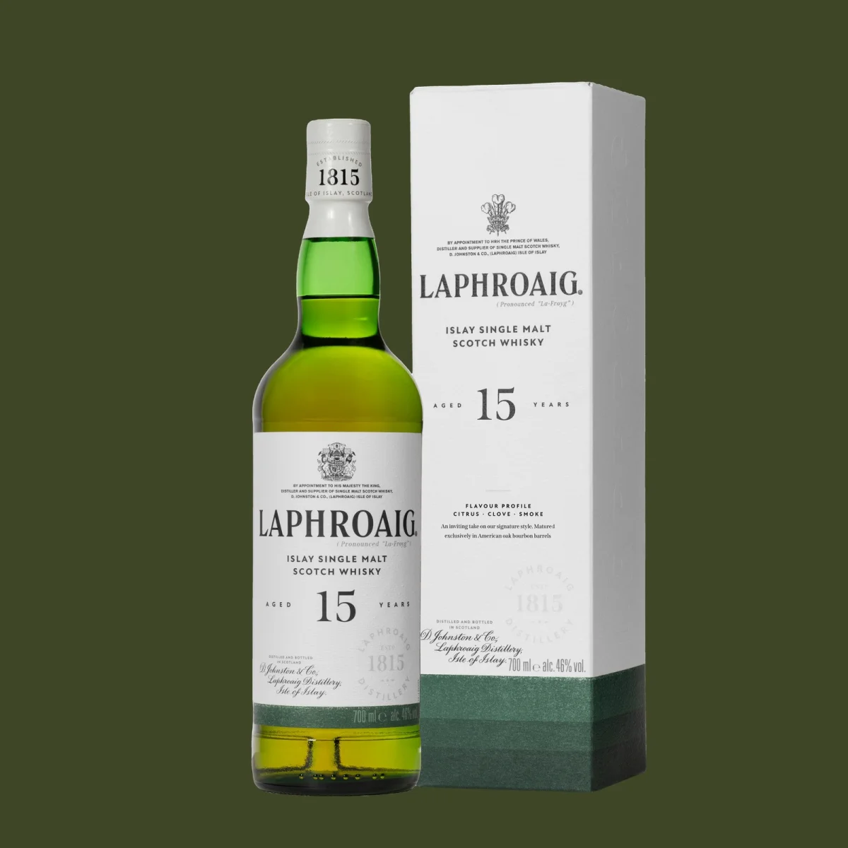 Laphroaig 15-year-old Islay single malt Scotch whisky bottle beside its white box packaging on a dark green background.