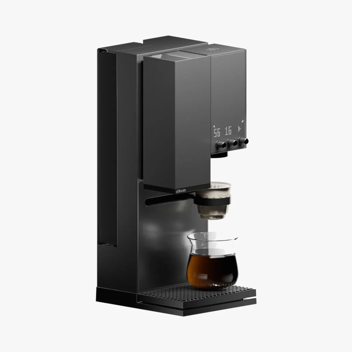 Black countertop coffee machine dispensing into a clear glass carafe.