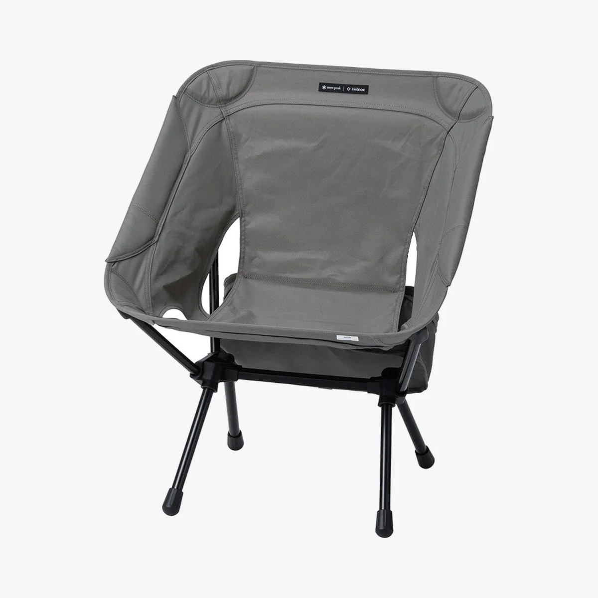 Gray folding camping chair with black metal legs and a Snow Peak x Helinox logo.