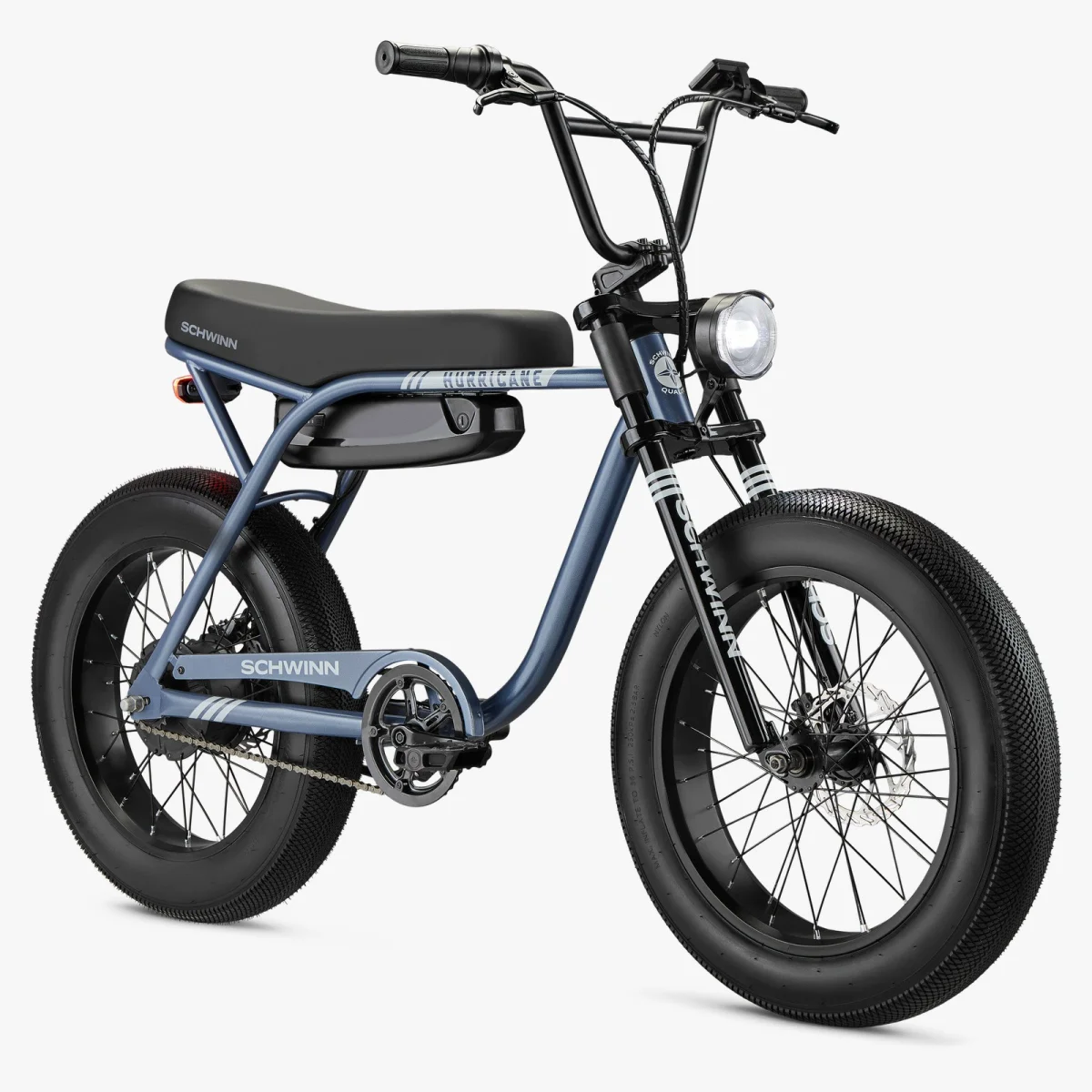 Modern blue Schwinn electric bike with fat tires, padded seat, front headlight, and black handlebars on a white background.