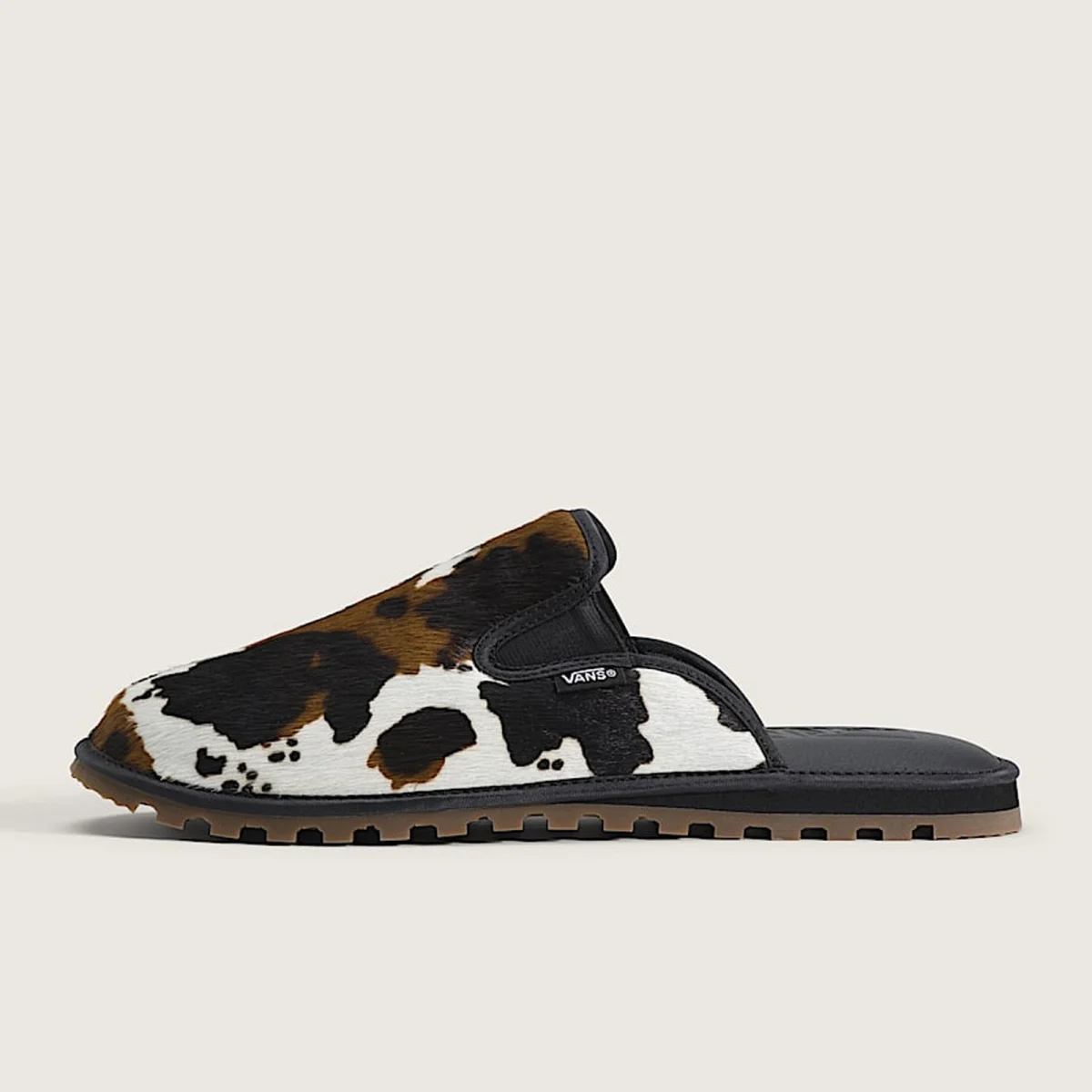 side shot of the vans cow print mule