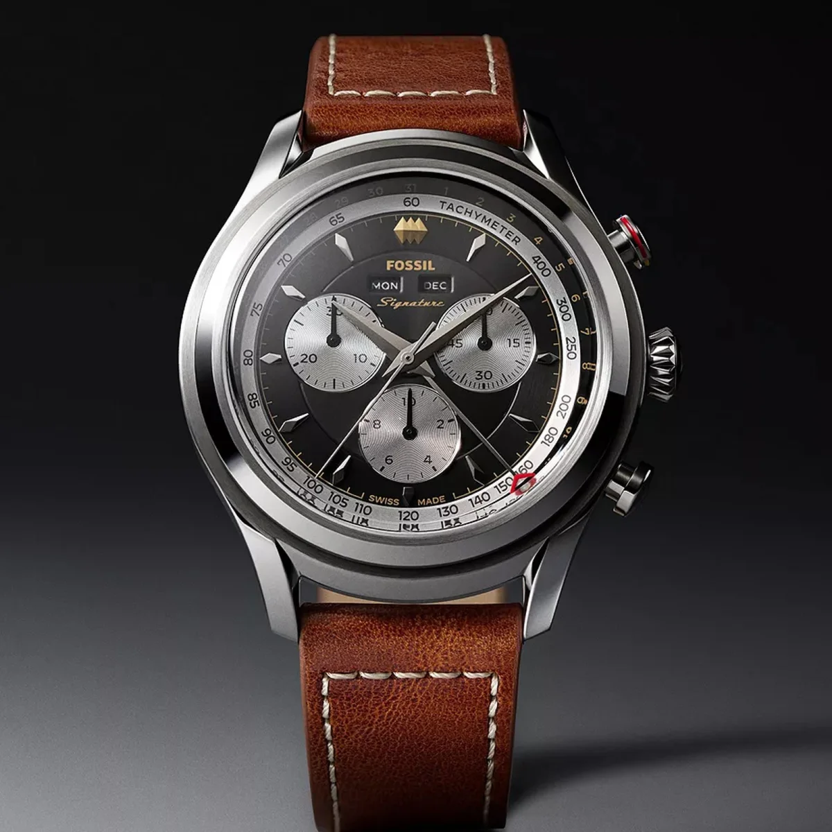 Fossil Signature chronograph watch featuring a black face, three silver subdials, and a brown leather strap.