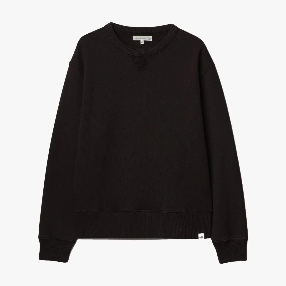 Black crewneck sweatshirt with long sleeves, ribbed cuffs and waistband, and a small white tag at the bottom hem.