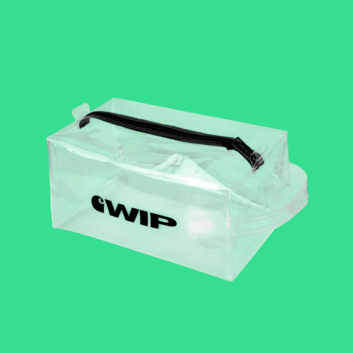 Transparent rectangular toiletry bag with black zipper and black "cWIP" text on a green background.