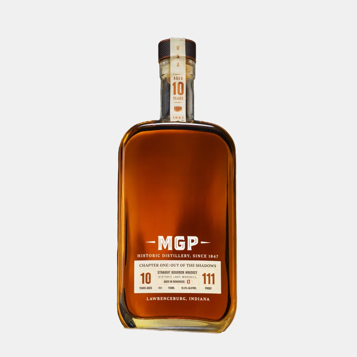 Rectangular bottle of MGP bourbon whiskey aged 10 years, with a tan detailed label showing 111 proof and Lawrenceburg, Indiana distillery, finished with a cork stopper; amber whiskey visible inside.