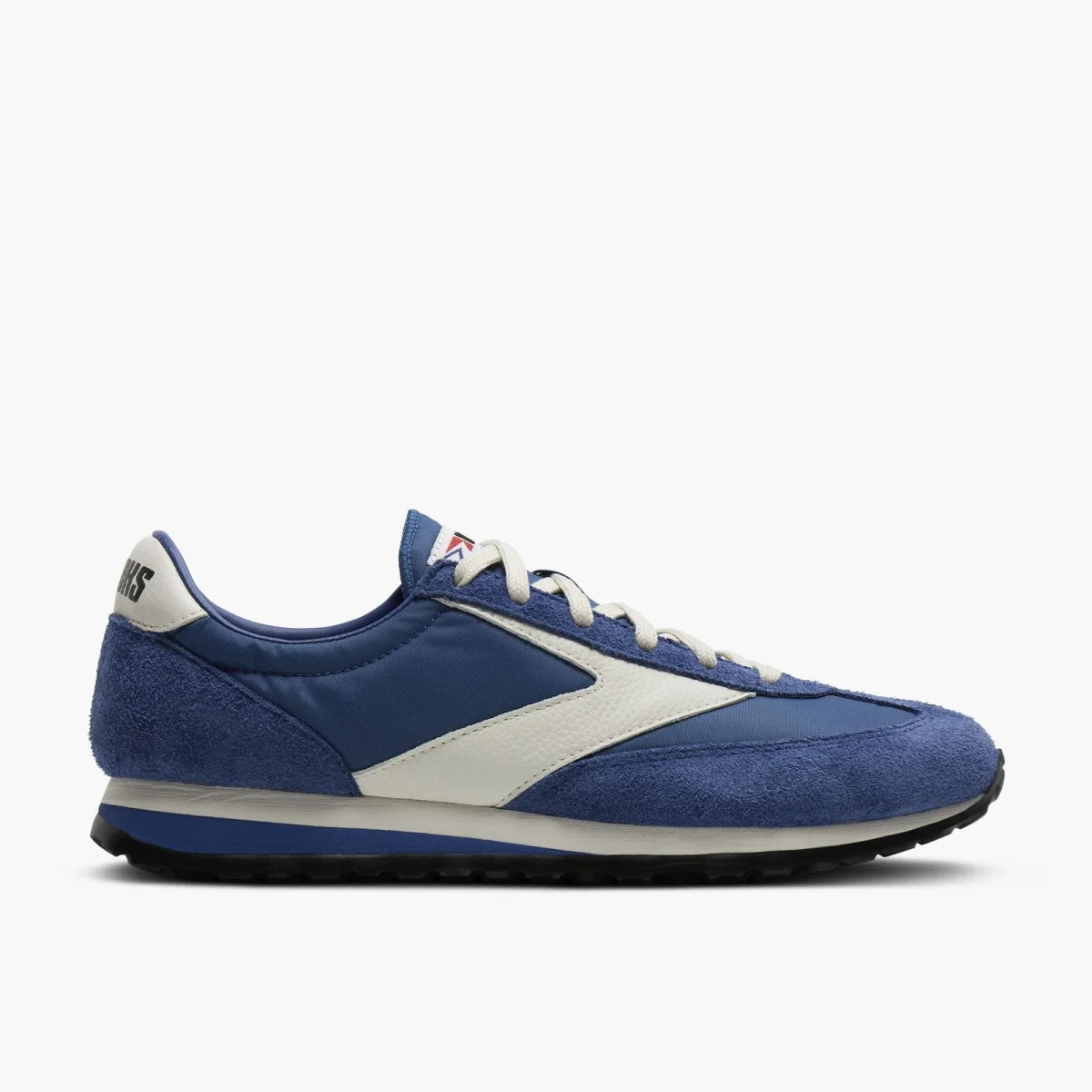 Blue Brooks sneaker featuring a white logo, suede and nylon upper, and a white and black rubber sole.