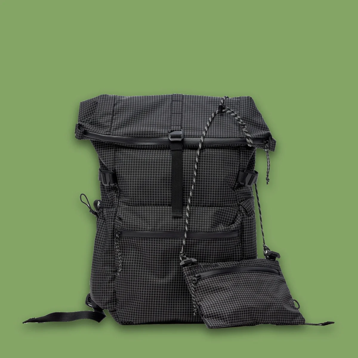 Black grid-patterned roll-top backpack with a matching detachable zippered pouch hanging from a cord.