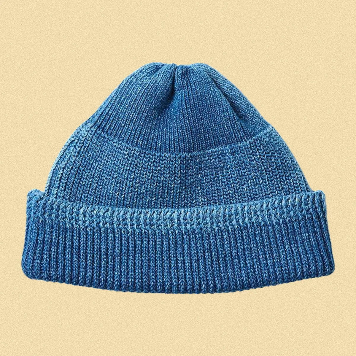 Blue knit beanie with a folded brim.