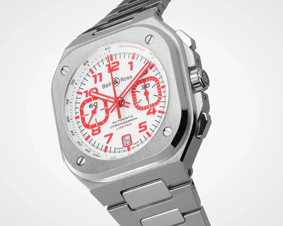 Bell & Ross chronograph wristwatch featuring a silver metal case and bracelet, a white dial with red numerals, and three sub-dials.