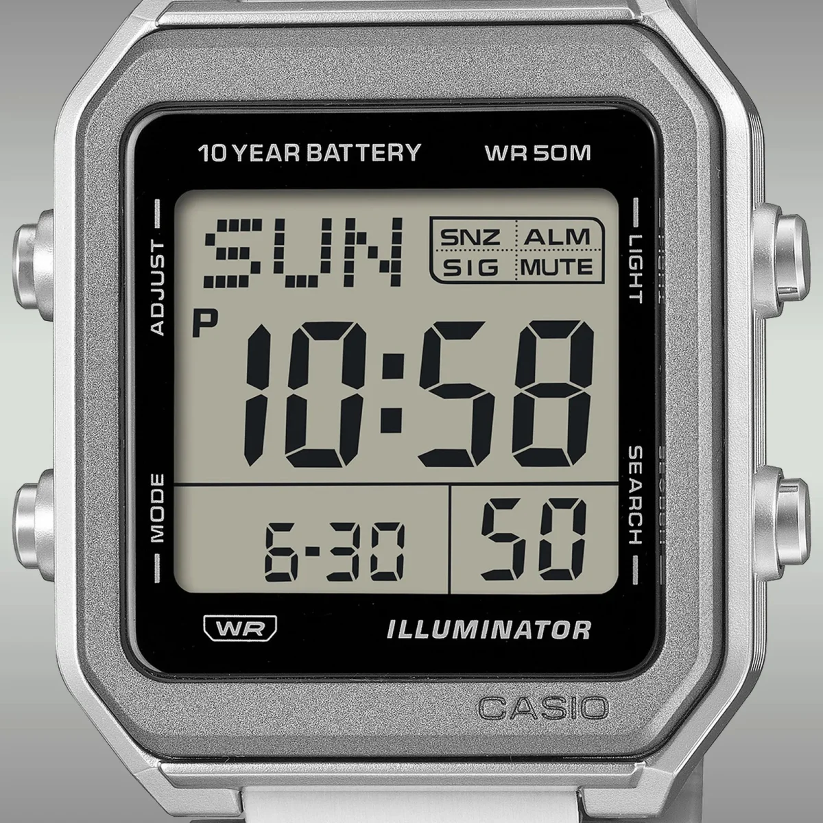 Casio digital watch featuring a silver-tone square case and a grey LCD screen displaying the time, date, and 10 YEAR BATTERY text.