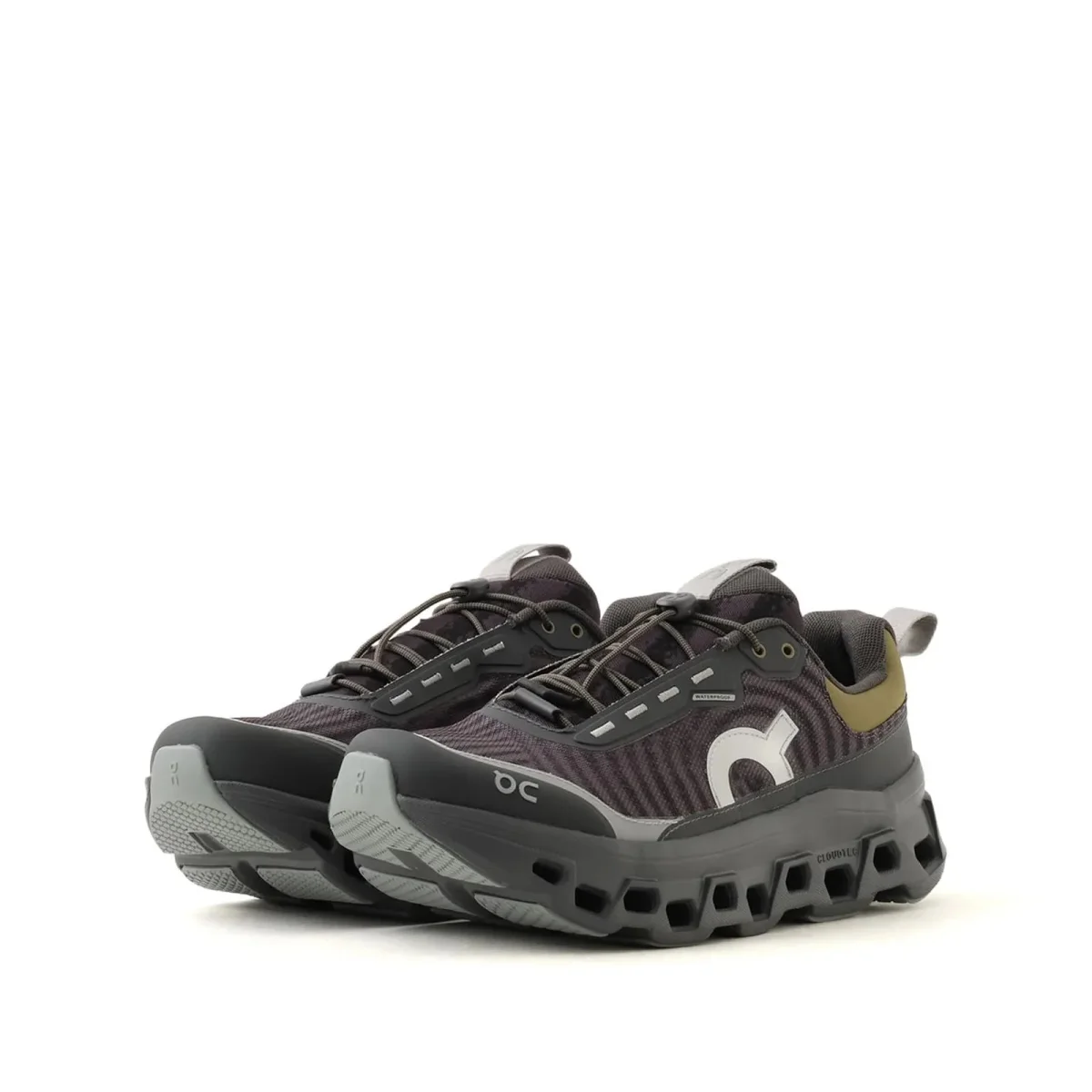 Dark grey On Cloud sneaker featuring a chunky lugged sole and toggle laces.
