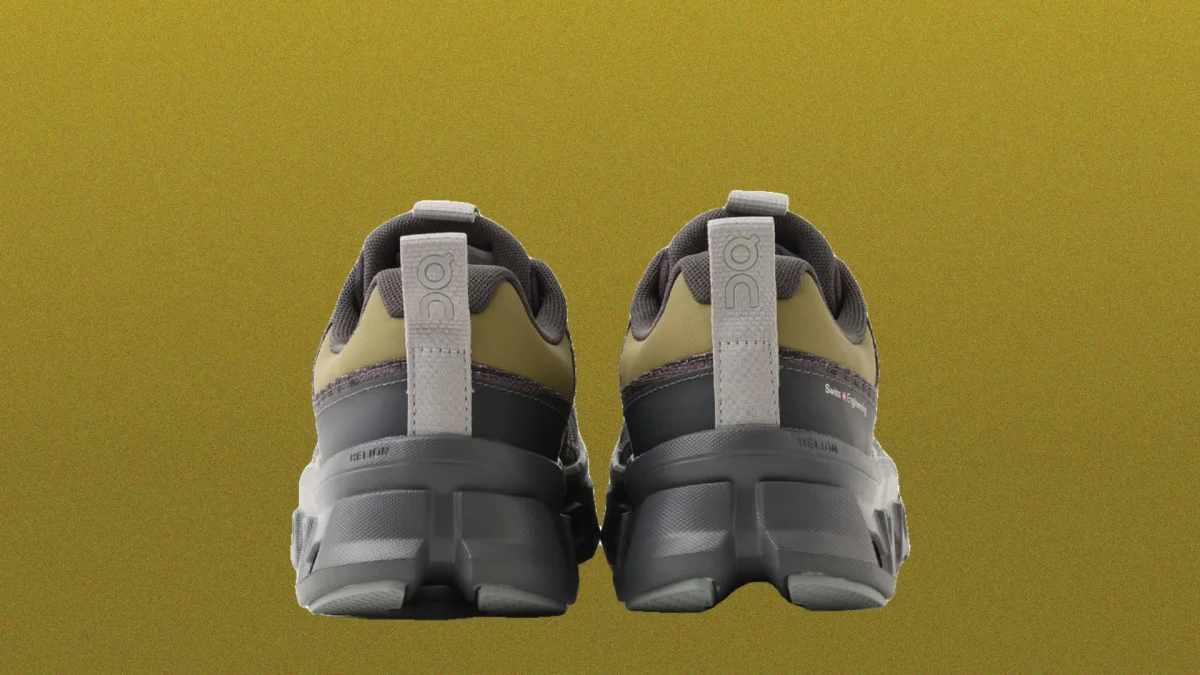 Rear view of olive green and grey On Running athletic shoes featuring chunky soles and heel pull tabs.