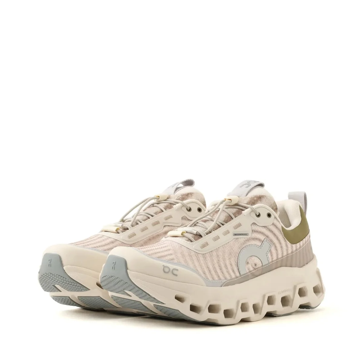Beige and olive green On Cloud waterproof running sneakers featuring chunky foam soles and speed lacing.