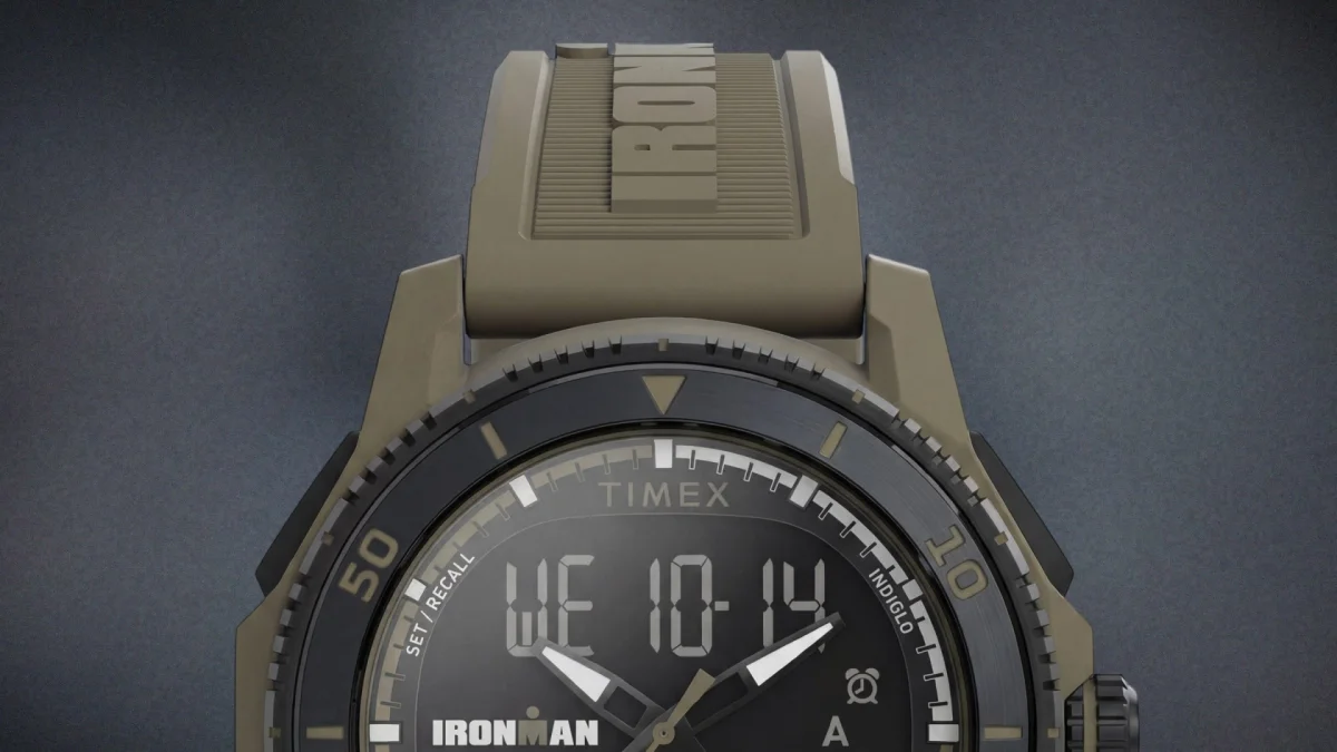Close-up of a Timex Ironman digital watch with a black dial and olive green strap.