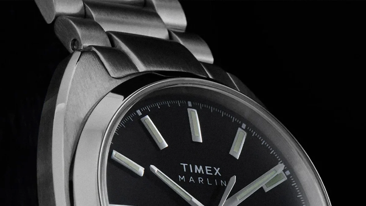 Close-up of a Timex Marlin watch with a black dial and silver metal bracelet.