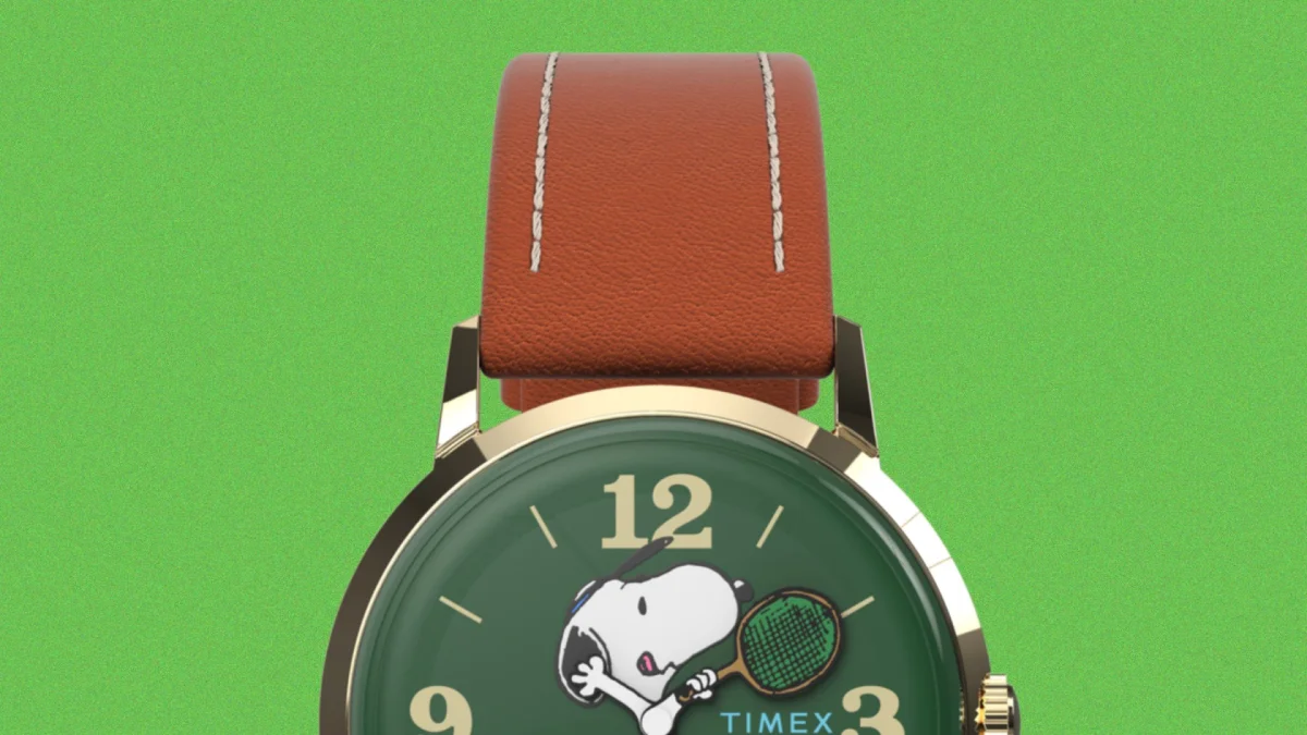 Timex wristwatch with a brown leather strap and Snoopy tennis dial on a green background.