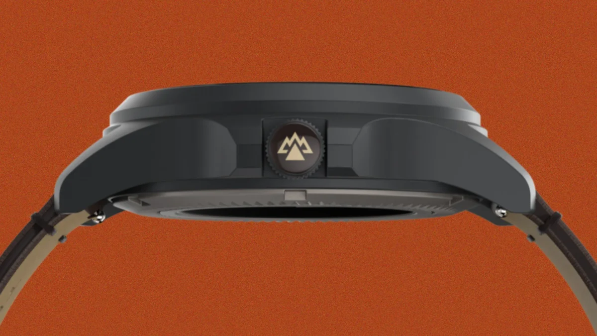 Side view of a black watch case with a crown featuring a mountain logo on an orange background.